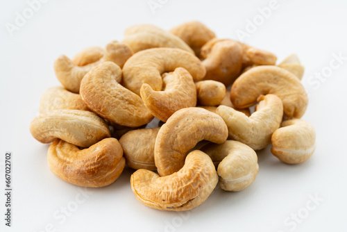 Dried cashew nuts. Macro shot. Raw snack. Pile cashew nuts without shell. Whole nut kernels	