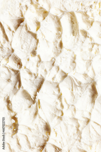 Close-up of delicious, sweet, organic cream with textured waves. Sweet cream for cakes and desserts. Concept of food, breakfast, healthy eating and snacks, organic, homemade products