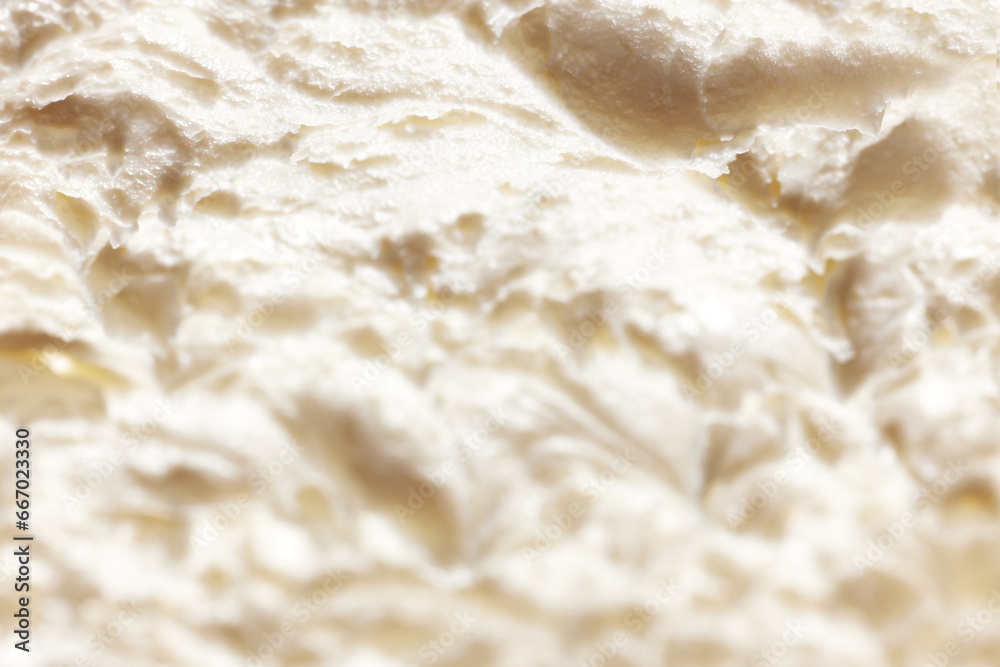 Close-up image of melted ice-cream. Vanilla natural ice cream texture. Concept of food, breakfast, healthy eating and snacks, organic, homemade products