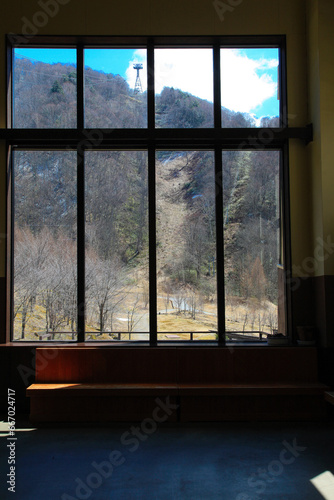 Scenery of the mountains in Japan Through the glass window view in the building of Shinhotaka Ropeway Station, in Takayama City, Gifu, Japan