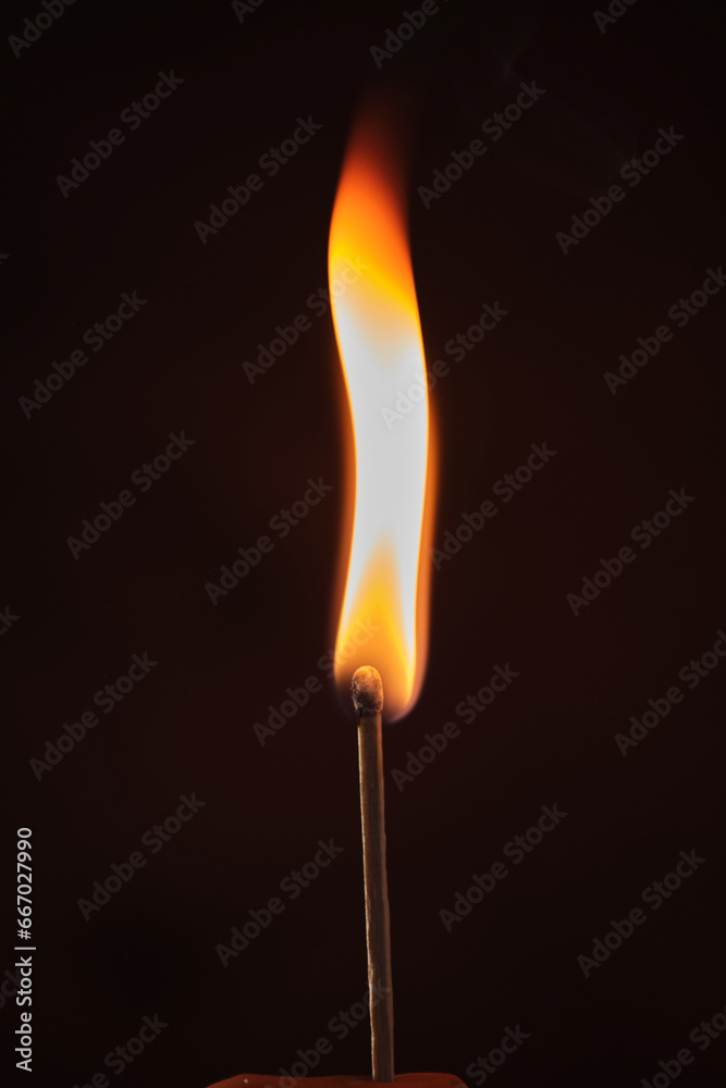 a lighted match on a dark background a lighted match on a dark background