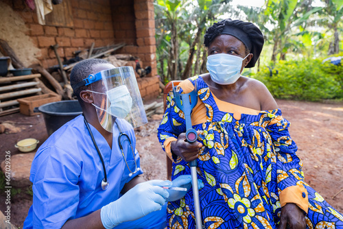 The village doctor visits a sick old woman and gives her an injection