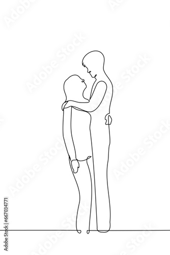 woman and man are hugging, he is much taller than her - one line art vector. concept lover with a large height difference