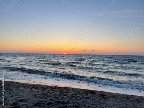 sun setting over the horizon of Adriatic Sea, Durres, Albania
dielli duke perenduar mbi horizontin e detit Adriatik, Durres, Shqiperi photo