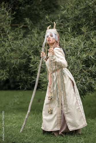 Beautiful girl in ethnic Karelian costume in nature photo