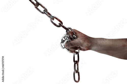 The hand of a scary zombie with blood and wounds tied on the iron chain
