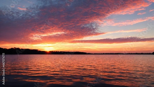Stunning sunset on the lake  purple sky.