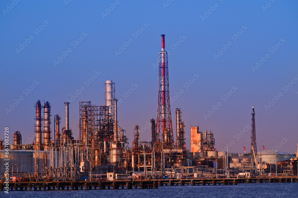 Japan industrial factory area with sunset blue sky background view from Fishing port, Yokohama City Japan.