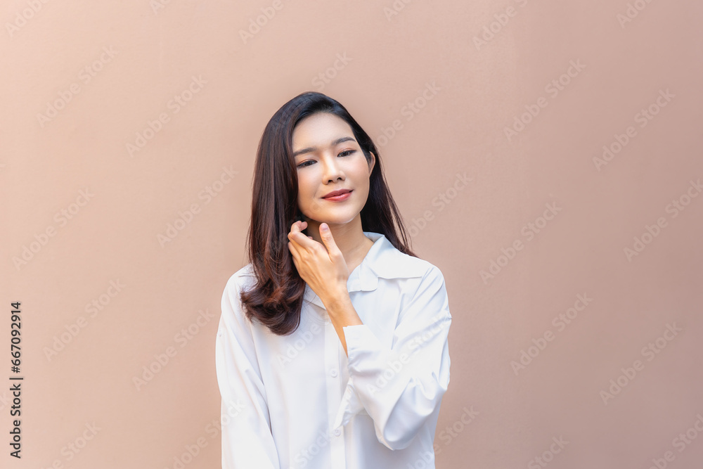 Asian Beauty, Reflective Gaze of a Radiant Young Adult Woman