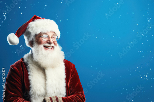 Santa claus against blue background, christmas