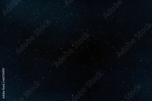 seamless texture and full-frame background of starry night sky and outer space. Neural network generated in May 2023. Not based on any actual scene or pattern.