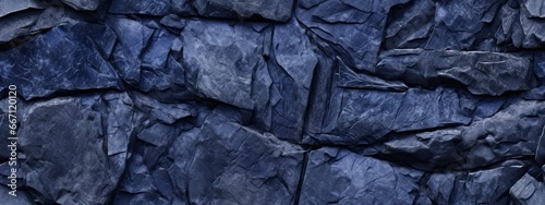 Seamless dark royal blue slate slab rock face background texture. Beautiful abstract grunge rough stone, plaster wall pattern with copy space, business backdrop