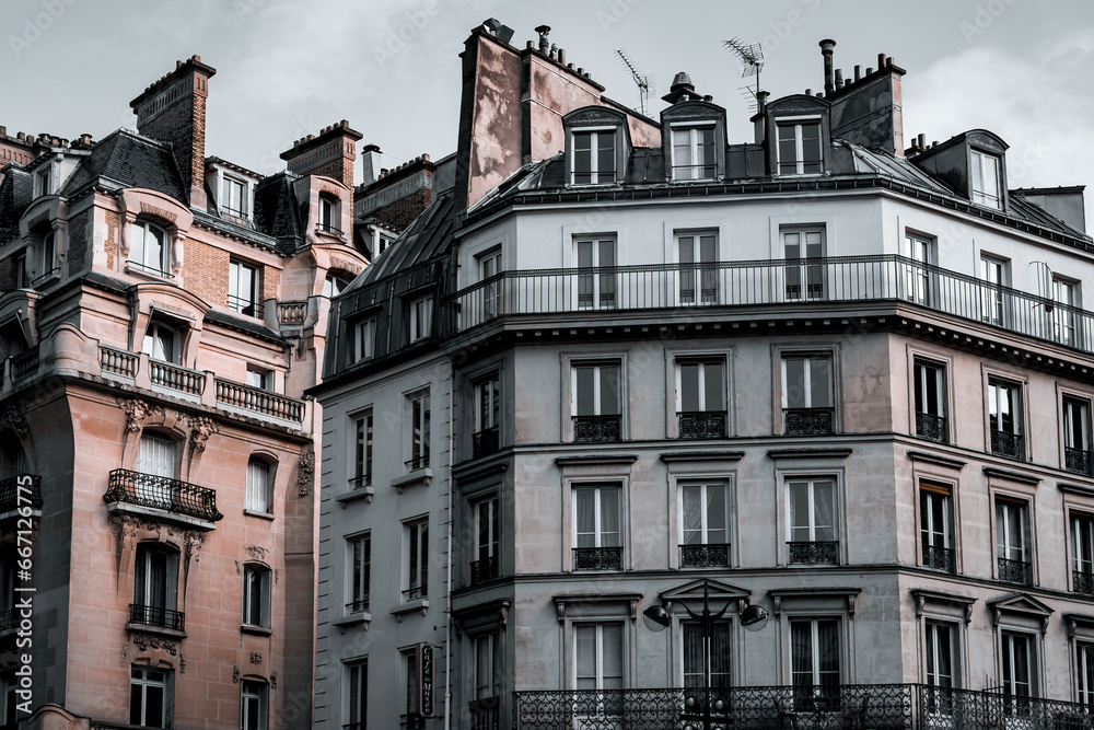 Paris architecture, duel-toned filter. Traditional Haussmann style of the 19th century. Haussmann renovated much of Paris at the request of Emperor Napoleon III.