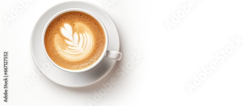A cappuccino coffee cup on a white background seen from above and bathed in soft light
