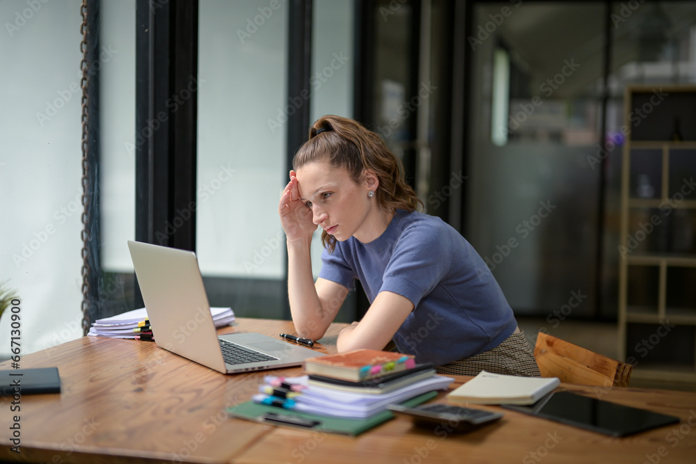 Businesswoman sitting in the office is stressed, working hard, feeling stressed and dizzy from work, making mistakes. Businesswoman sitting in the office is stressed, working hard, feeling stressed and dizzy from work, making mistakes.