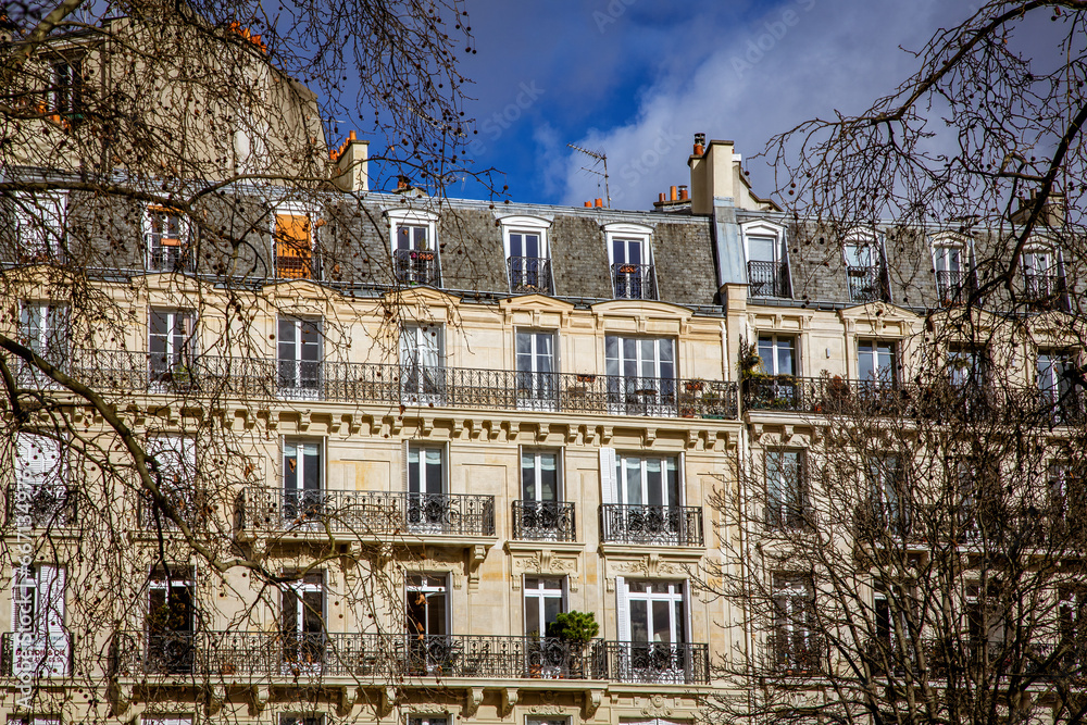 Paris architecture. Traditional Haussmann style of the 19th century. Haussmann renovated much of Paris at the request of Emperor Napoleon III. - obrazy, fototapety, plakaty 