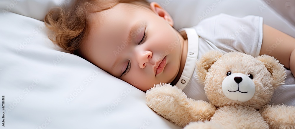 Cute infant peacefully resting with a stuffed animal Cute infant peacefully resting with a stuffed animal
