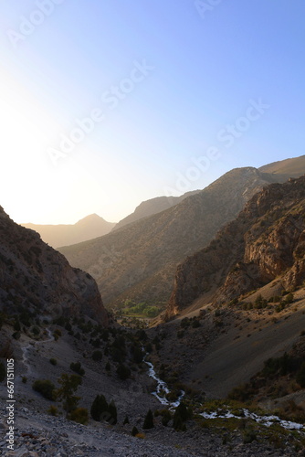 Mountain landscape on a hiking trail from Artuch tu Kulikalon lakes in Fann Mountains, Tajikistan photo