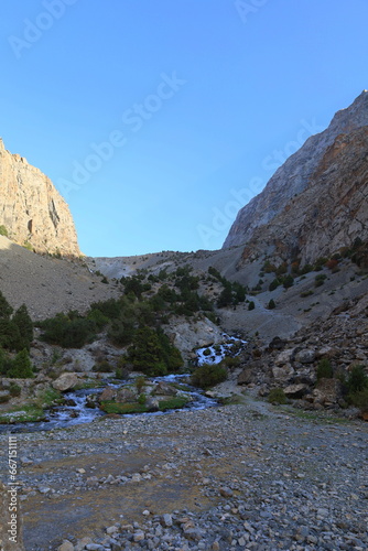 Mountain landscape on a hiking trail from Artuch tu Kulikalon lakes in Fann Mountains, Tajikistan photo