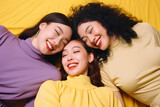 A diverse group of young women is captured in a joyful and vibrant photo, radiating happiness with a warm yellow tone. Generative AI.
