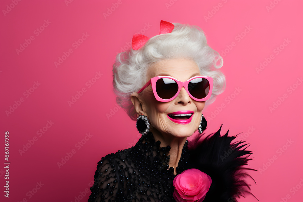 Fashionable elderly woman isolated on pink Fashionable elderly woman isolated on pink