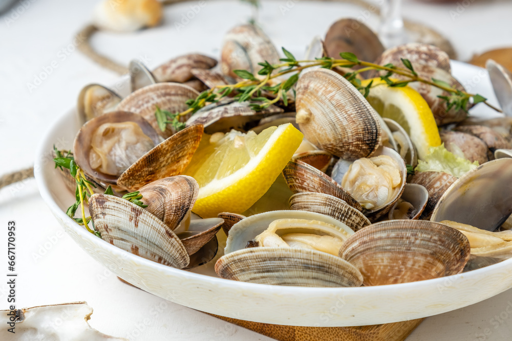 Vongole prepared with lemon and herbs close-up Vongole prepared with lemon and herbs close-up