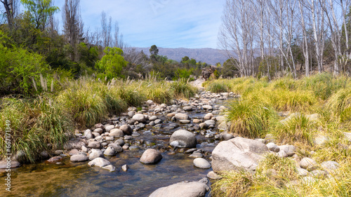 calm narrow creek of crystal mountain water in Nono, Cordoba. Taken on a warm spring afternoon