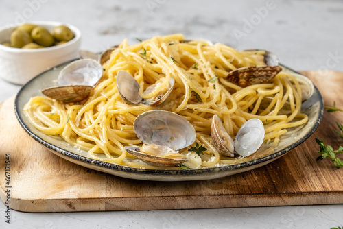 Appetizing pasta with shellfish, spaghetti with vongole, with garlic sauce, traditional dish, spaghetti alla vongole photo