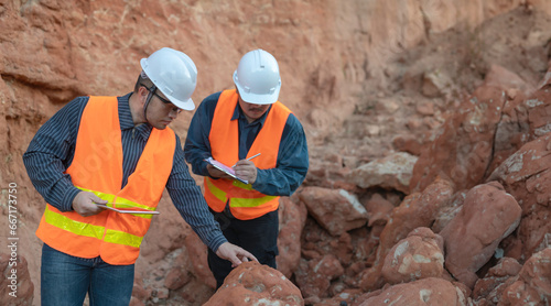 Geologist surveying mine,Explorers collect soil samples to look for minerals. photo