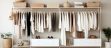Women s clothing and accessories displayed in a white wardrobe