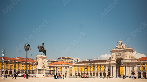Lisbon, Portugal - May 25, 2023: Praca do comercio view on a sunny day with the monument and the Augusta Arch in the background