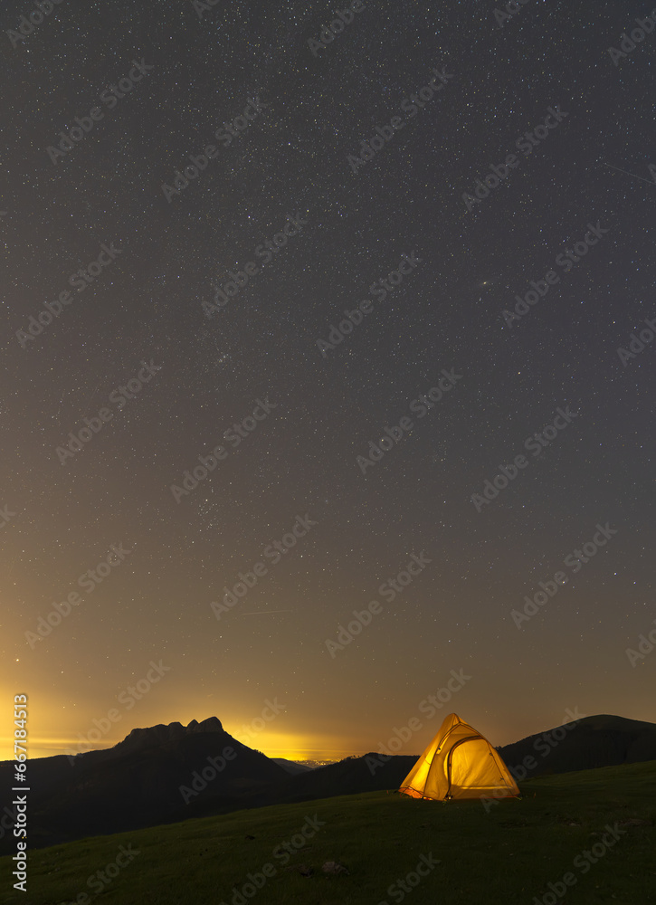 Tent and night with stars in the Aiako Harriak Natural Park, Euskadi