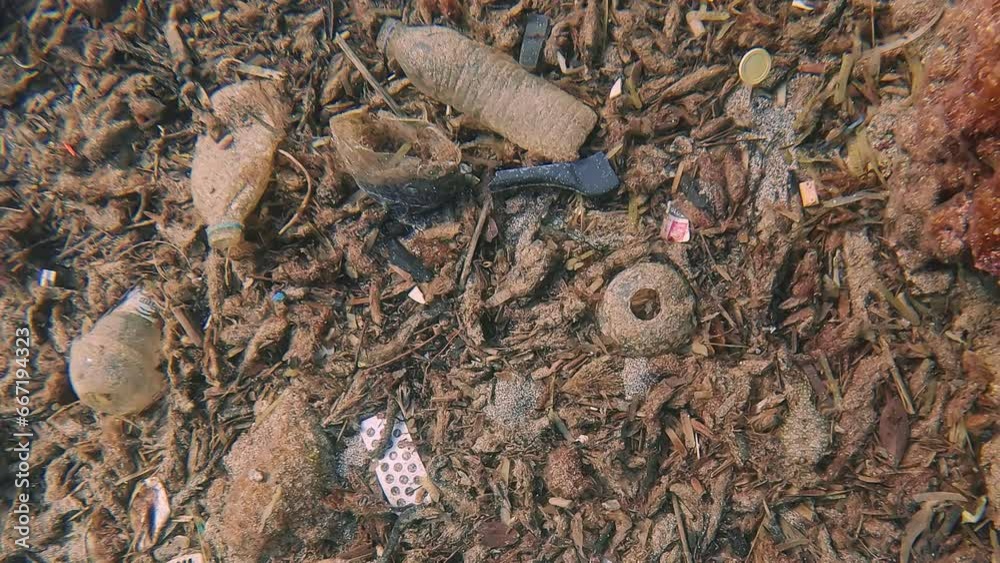 Camera moves upward revealing view of scale of plastic pollution, Close ...