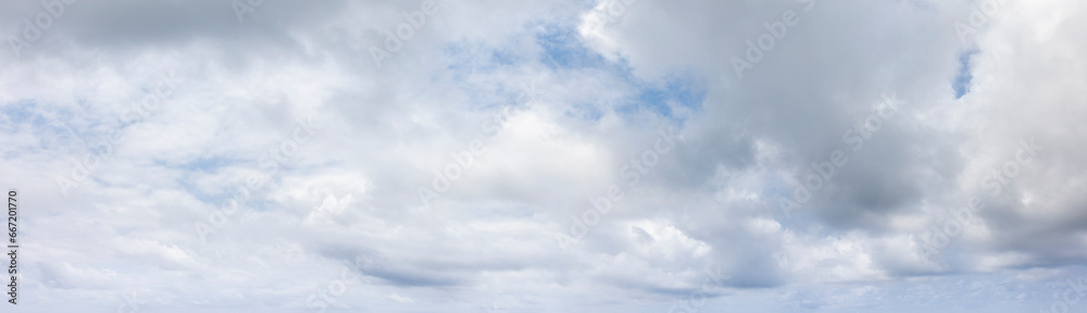Panoramic grey sky with small blue sky patches - obrazy, fototapety, plakaty 