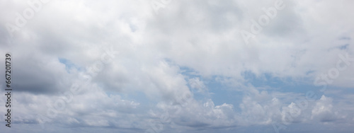 Panoramic grey sky with small blue sky patches