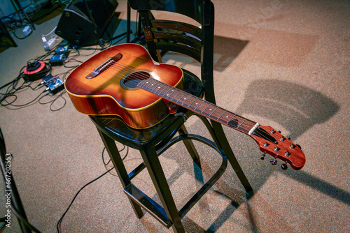 musical instrument acoustic guitar lies on a chair