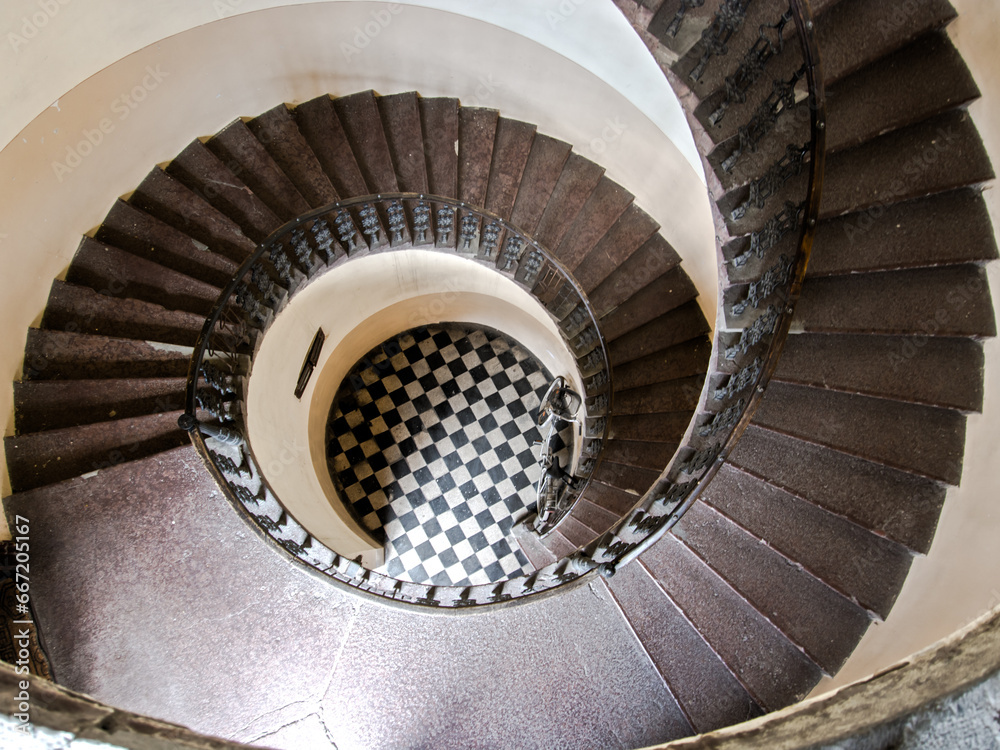 Fototapeta premium Spiral staircase in an old apartment house