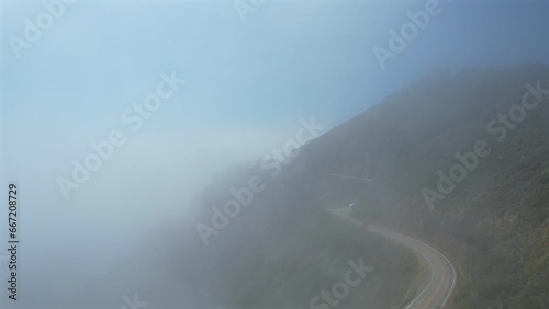 Amazing aerial view on pacific coast highway, route 1 landscape during daytime, above clouds