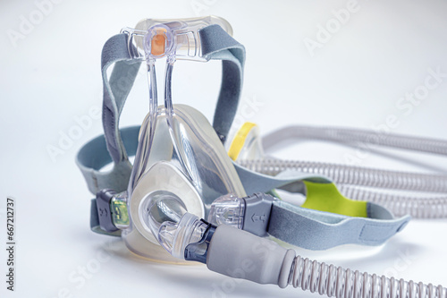 Continuous positive airway pressure- mask (CPAP) and hose isolated on white background