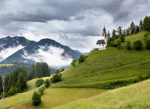 Santa Barbara Church during a cloudy day in the beautiful mountain village of La Valle, Alta Badia, South Tyrol, Italy, Europe