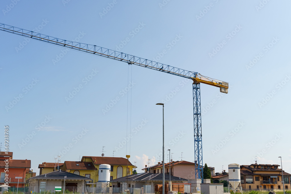 Crane tower on a residential building construction site. Crane tower on a residential building construction site.