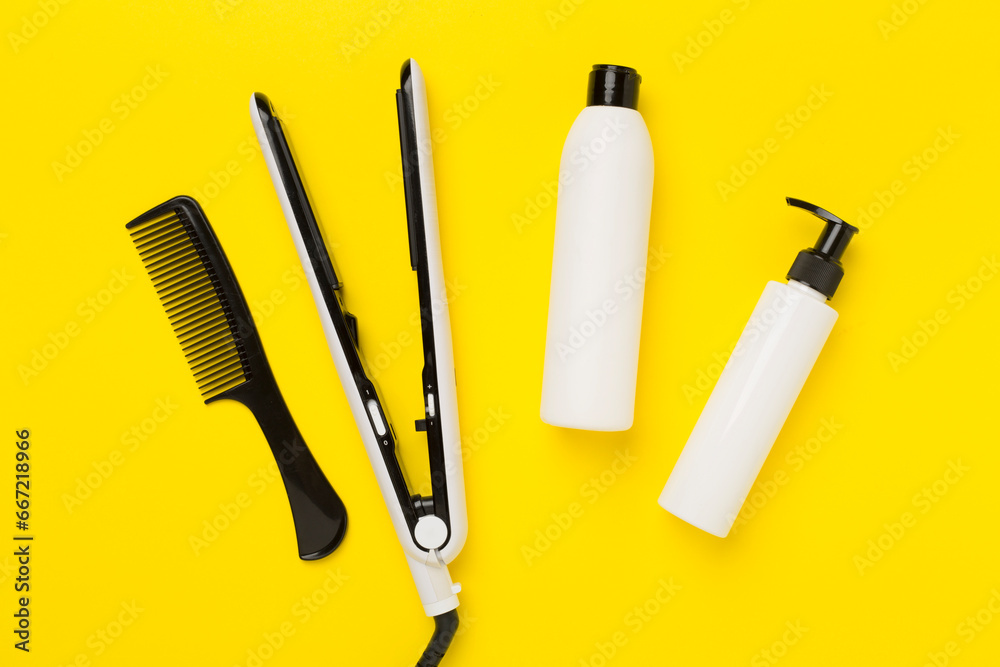 Hair straightener with thermo protection on color background, top, view Hair straightener with thermo protection on color background, top, view
