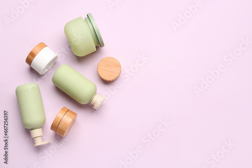 Set of different cosmetic products on lilac background