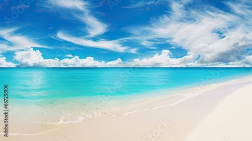 Beautiful sandy beach background. Bright summer sun over the ocean.Blue sky with light clouds, turquoise ocean with surf and clear white sand. © Creative Canvas