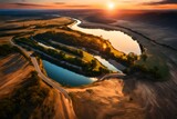 An aerial view of river and road against scenic sunset