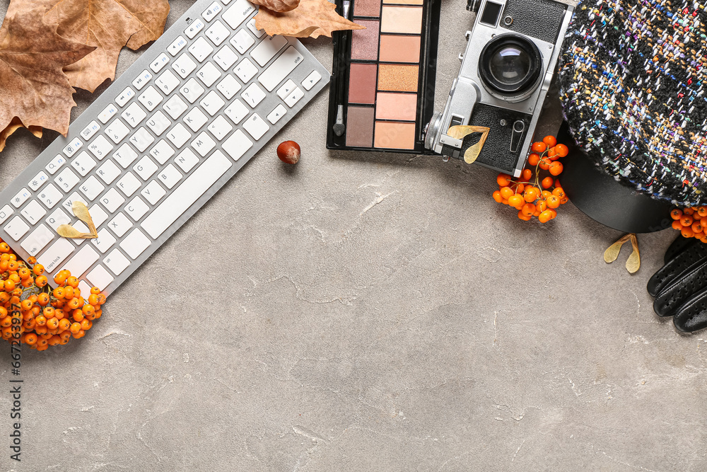 Composition with female accessories, keyboard, eyeshadows and rowan berries on grunge background - obrazy, fototapety, plakaty 