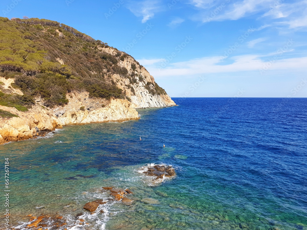 Seascape of Elba island with blue sea and rocks. The nature of the island of Elba.