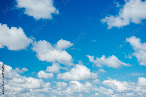 Blue sky background with white clouds.