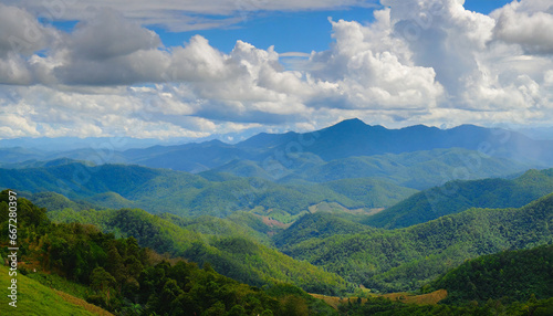amazing wild nature view of layer of mountain forest landscape with cloudy sky natural green scenery of cloud and mountain slopes background maehongson thailand panorama view © Richard