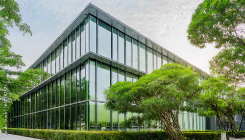 eco friendly glass office sustainable building with trees and green environment